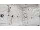 Luxury shower features marble tiling, dual shower heads, and a glass enclosure at 110 White Oak Trl, Cumming, GA 30028