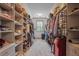 Spacious walk-in closet with custom shelving and ample storage space at 110 White Oak Trl, Cumming, GA 30028