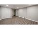 Basement features wood-look flooring and neutral paint, with a large closet for storage and natural light at 1331 Windage Sw Ct, Marietta, GA 30008