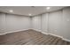 Basement features wood-look flooring and neutral paint, and recessed lighting for a bright and airy feel at 1331 Windage Sw Ct, Marietta, GA 30008