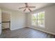 Bedroom features wood-look flooring and neutral paint, and a large window overlooking a wooded view at 1331 Windage Sw Ct, Marietta, GA 30008