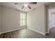 Bedroom features wood-look flooring and neutral paint, and a doorway leading to another room at 1331 Windage Sw Ct, Marietta, GA 30008
