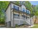 Classic two-story home featuring a covered front porch and manicured landscaping at 1331 Windage Sw Ct, Marietta, GA 30008