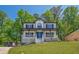 Inviting two-story home with a covered front porch and well-maintained lawn at 1331 Windage Sw Ct, Marietta, GA 30008