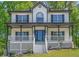 Charming two-story home featuring a welcoming front porch and manicured lawn at 1331 Windage Sw Ct, Marietta, GA 30008