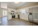 Well-lit kitchen featuring white cabinets, stainless steel appliances, and a window view at 1331 Windage Sw Ct, Marietta, GA 30008