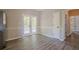Open floorplan features wood-look floors, chair rail and double doors to the outdoor space at 1331 Windage Sw Ct, Marietta, GA 30008