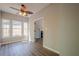 Bright living room with wood-look floors and a view to the fireplace beyond the doorway at 1331 Windage Sw Ct, Marietta, GA 30008