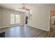 Cozy living room with wood look floors, a large window and views of the front entry and staircase at 1331 Windage Sw Ct, Marietta, GA 30008