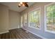 Bright room featuring lots of natural light from large windows and wood-look laminate flooring at 1331 Windage Sw Ct, Marietta, GA 30008