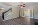 Spacious living room featuring elegant flooring, staircase, and French doors leading to a sunroom at 1331 Windage Sw Ct, Marietta, GA 30008