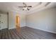 Spacious bedroom featuring a decorative ceiling, wood look floors and a view to the ensuite at 1331 Windage Sw Ct, Marietta, GA 30008