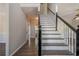 Inviting foyer with hardwood floors and a classic staircase leading to the upper level of the home at 1331 Windage Sw Ct, Marietta, GA 30008