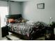 This cozy bedroom features a window for natural light and a dark wood frame bed at 153 Helen Rd, Covington, GA 30016