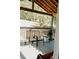 View of the covered porch, furnished with chairs for relaxing outdoors at 153 Helen Rd, Covington, GA 30016