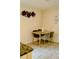 Inviting dining area with a glass-topped table and stylish chairs, complemented by decor at 153 Helen Rd, Covington, GA 30016