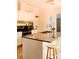 Stylish kitchen showcasing granite countertops, white cabinets, and modern appliances at 153 Helen Rd, Covington, GA 30016