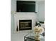 Cozy living room features a fireplace and decorative mantel, creating a warm and inviting space at 153 Helen Rd, Covington, GA 30016