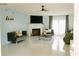 Bright living room with stylish furnishings, a fireplace, and large windows for ample light at 153 Helen Rd, Covington, GA 30016