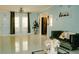 Spacious living room with ample natural light, modern decor, and sleek tiled floors at 153 Helen Rd, Covington, GA 30016