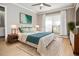 Bright bedroom featuring neutral walls, a ceiling fan, and natural light streaming in through the large window at 407 Coleraine Se, Smyrna, GA 30080