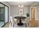 Bright dining room with modern decor, chandelier, and sliding glass door at 407 Coleraine Se, Smyrna, GA 30080