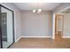 Bright dining room with modern chandelier and sliding glass door at 407 Coleraine Se, Smyrna, GA 30080