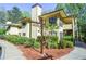 Lovely condo building with a sign and well maintained landscaping at 407 Coleraine Se, Smyrna, GA 30080