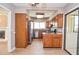 Cozy kitchen featuring wood cabinets, stainless steel appliances, and granite countertops at 407 Coleraine Se, Smyrna, GA 30080