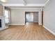 Open-concept living room features wood floors, fireplace, and plenty of natural light at 407 Coleraine Se, Smyrna, GA 30080