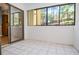 Bright patio area with tile floor and view to the backyard at 407 Coleraine Se, Smyrna, GA 30080