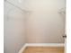 Walk-in closet with neutral walls, wood-look flooring and metal shelving at 407 Coleraine Se, Smyrna, GA 30080