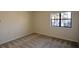 Cozy bedroom featuring neutral carpet, bright natural light from a window, and calming aesthetic at 475 Mount Vernon Ne Hwy # C-220, Sandy Springs, GA 30328