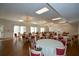 This dining room features hardwood floors, pendant lighting, and large windows for a welcoming atmosphere at 475 Mount Vernon Ne Hwy # C-220, Sandy Springs, GA 30328