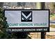 Community sign, showcasing the Mount Vernon Village name and street address at 475 Mount Vernon Ne Hwy # C-220, Sandy Springs, GA 30328