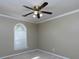 Cozy bedroom featuring ceiling fan, natural light and neutral color palette at 1234 W Wylie Bridge Rd, Woodstock, GA 30188