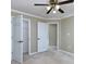 Spacious bedroom featuring neutral walls, carpet flooring, and a ceiling fan with a light fixture at 1234 W Wylie Bridge Rd, Woodstock, GA 30188
