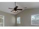 Spacious bedroom featuring ceiling fan and natural light from two windows at 1234 W Wylie Bridge Rd, Woodstock, GA 30188