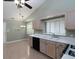 A kitchen with wood cabinets, white countertop, and window at 1234 W Wylie Bridge Rd, Woodstock, GA 30188