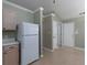 The kitchen space includes bright white appliances, wood-look floors, and plenty of storage at 1234 W Wylie Bridge Rd, Woodstock, GA 30188