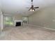 Spacious living room featuring high ceilings, a fireplace, and natural light, showcasing its potential at 1234 W Wylie Bridge Rd, Woodstock, GA 30188