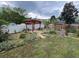 Landscaped backyard with pergola, lush garden and walkway at 3147 Pine Needle Sw Ct, Lilburn, GA 30047