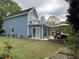 Back of home featuring a large deck, patio and manicured lawn at 3147 Pine Needle Sw Ct, Lilburn, GA 30047