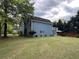 Back of home featuring a large deck, patio and manicured lawn at 3147 Pine Needle Sw Ct, Lilburn, GA 30047