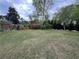 Expansive backyard with a well-maintained lawn and mature trees at 3147 Pine Needle Sw Ct, Lilburn, GA 30047