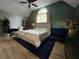 Well-lit bedroom with hardwood floors, neutral color scheme, and modern furnishings at 3147 Pine Needle Sw Ct, Lilburn, GA 30047