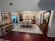 Open concept dining area with hardwood floors and sliding door access to the backyard at 3147 Pine Needle Sw Ct, Lilburn, GA 30047