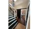 Elegant foyer with hardwood floors, a staircase, and a view of the kitchen at 3147 Pine Needle Sw Ct, Lilburn, GA 30047
