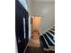 Well-lit foyer featuring hardwood floors, stylish front door, and a view of the staircase at 3147 Pine Needle Sw Ct, Lilburn, GA 30047