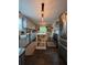 Open kitchen with gray cabinets, stainless appliances, an island, and backyard view at 3147 Pine Needle Sw Ct, Lilburn, GA 30047